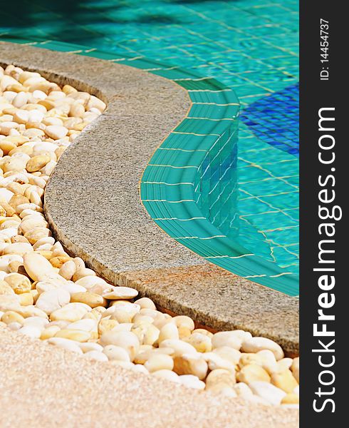Vertical composition of curved side of a swimming pool.