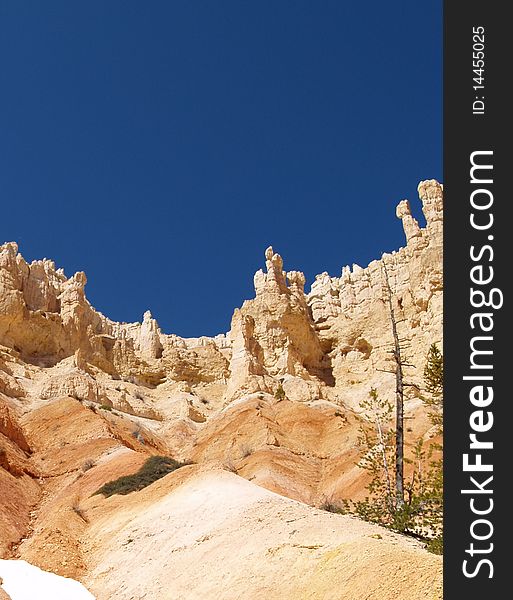 View of hoodoos and cliffs from the base of Bryce canyon. View of hoodoos and cliffs from the base of Bryce canyon