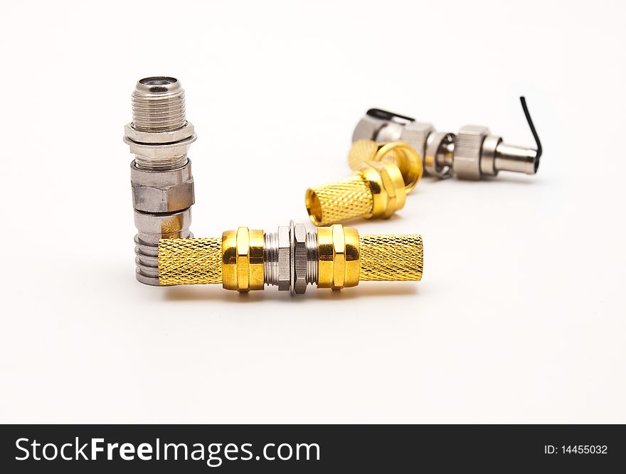 Gilded television connectors on a white background