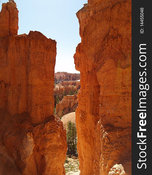 View between hoodoos and cliffs along the trail at Bryce canyon, Ut. View between hoodoos and cliffs along the trail at Bryce canyon, Ut