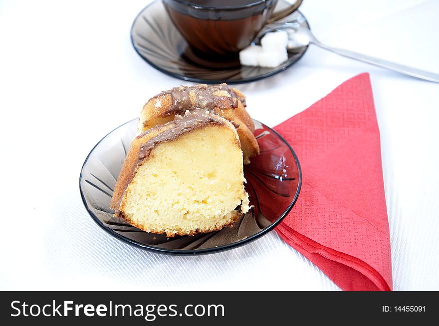 Marble cake on plate with tea