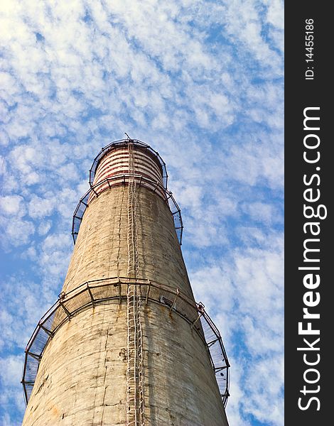 Industry chimney in a blue sky on sunny day