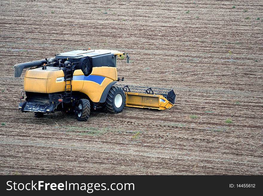 Aerial landscape with rural field and tractor at hot summer