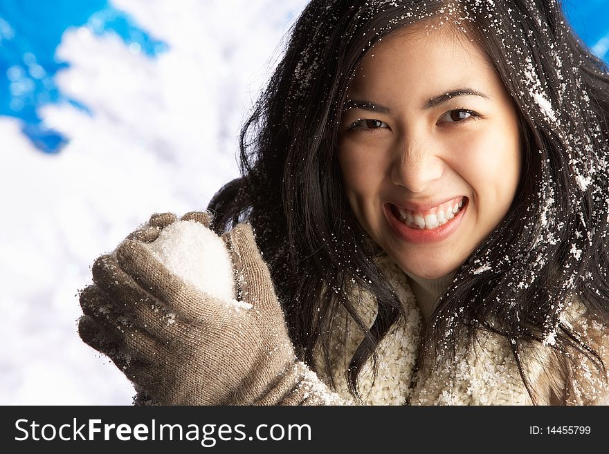 Woman Wearing Winter Clothes In Studio