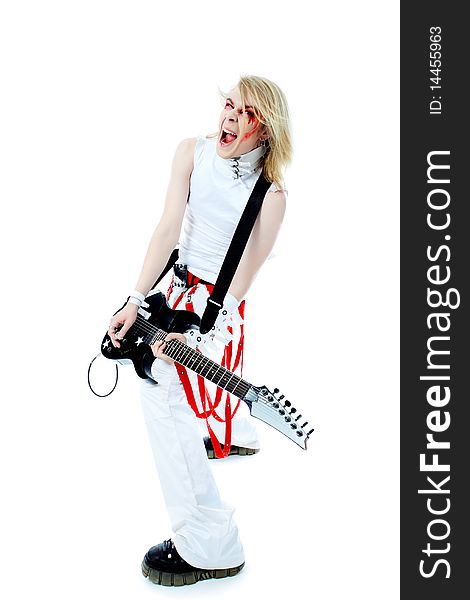 Rock musician is playing electrical guitar. Shot in a studio. Rock musician is playing electrical guitar. Shot in a studio.