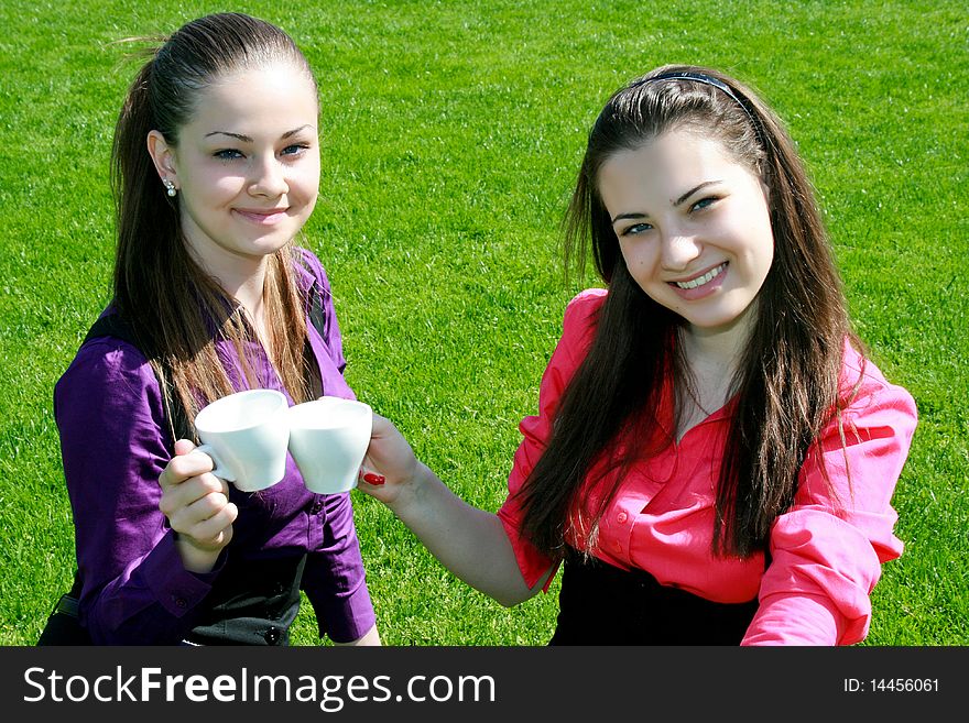 Young Businesswomen Drinking Tea And Talking