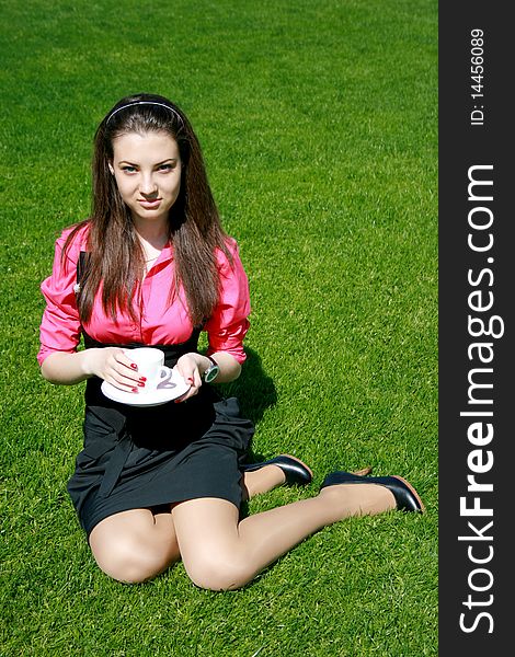 Young businesswoman with cup of tea