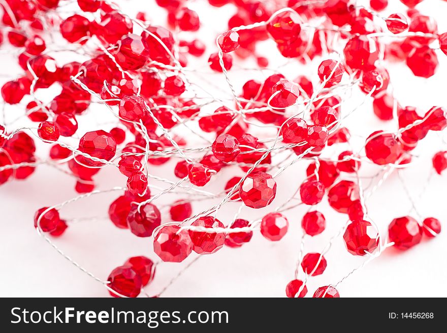 A chain with red jewels isolated on white. A chain with red jewels isolated on white