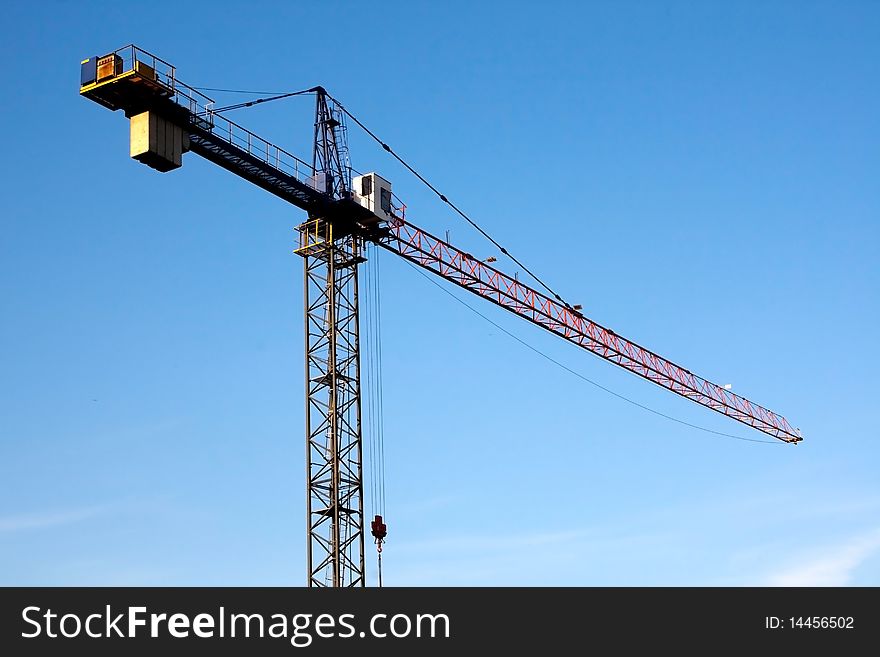 View of building crane and blue sky