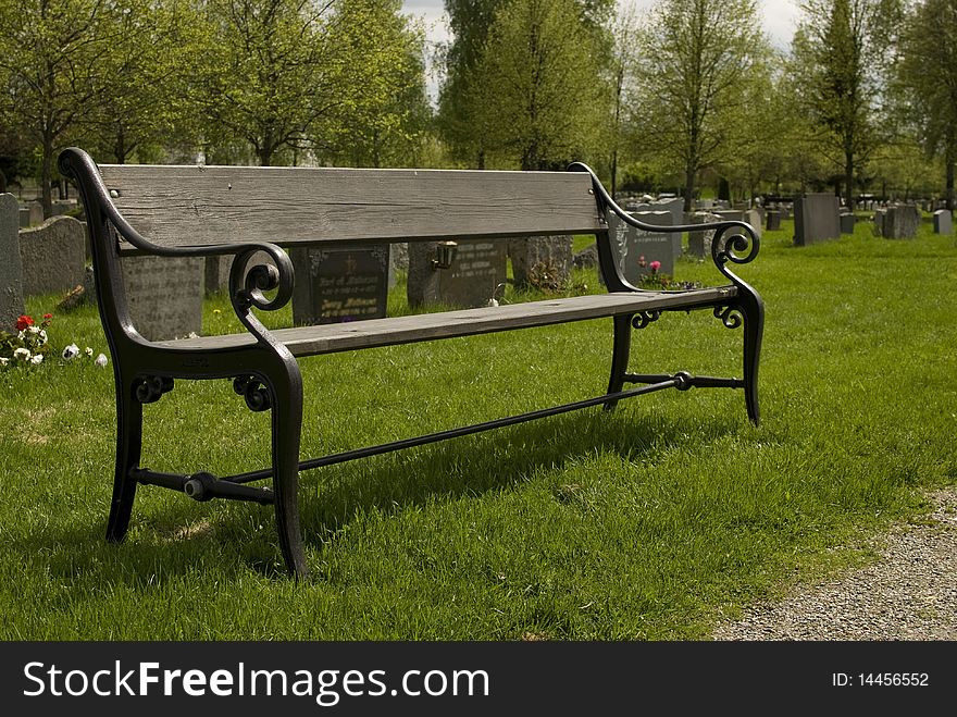 The Park Wooden Bench in old cemetery.