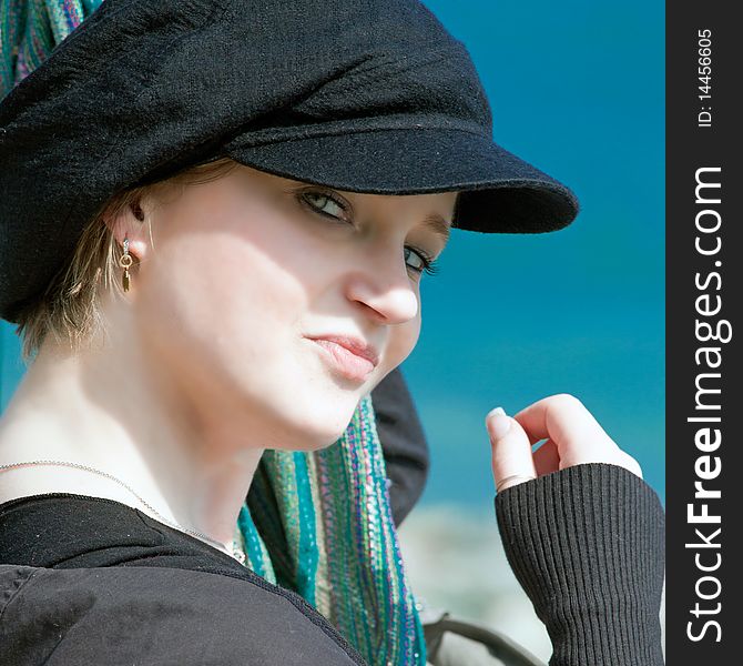Blonde girl with black hat and dislike expression