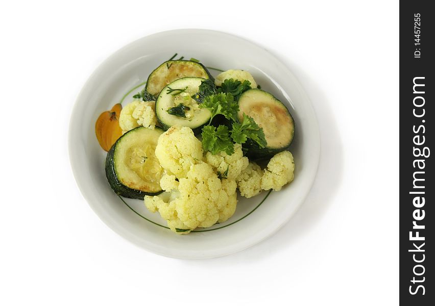 Stewed vegetables in a bowl on a white background