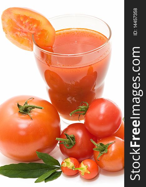 Tomatoes and tomato juice on white background