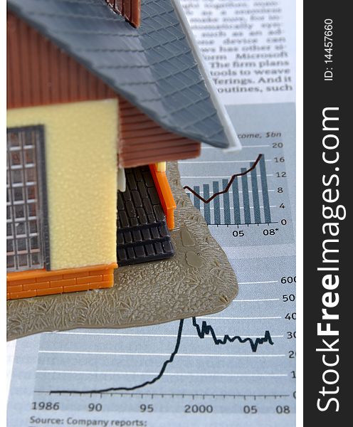 House model and economy information and chart, means analysis about real estate and economy, investment or house building industry