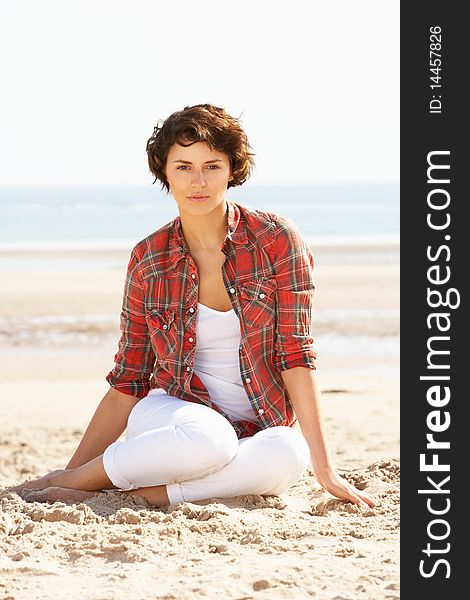 Young Woman Relaxing On Beach