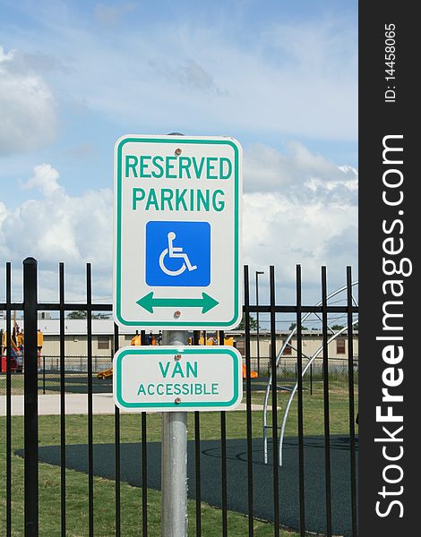 A handicapped parking, van accessible sign