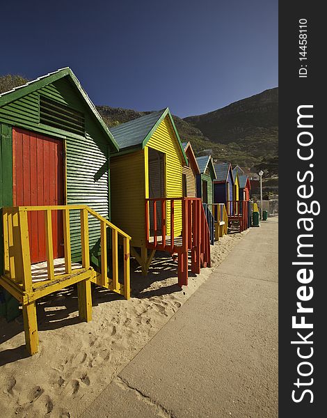 Colourful wooden changing cabins at the beach. St James beach, Cape Town. Colourful wooden changing cabins at the beach. St James beach, Cape Town.