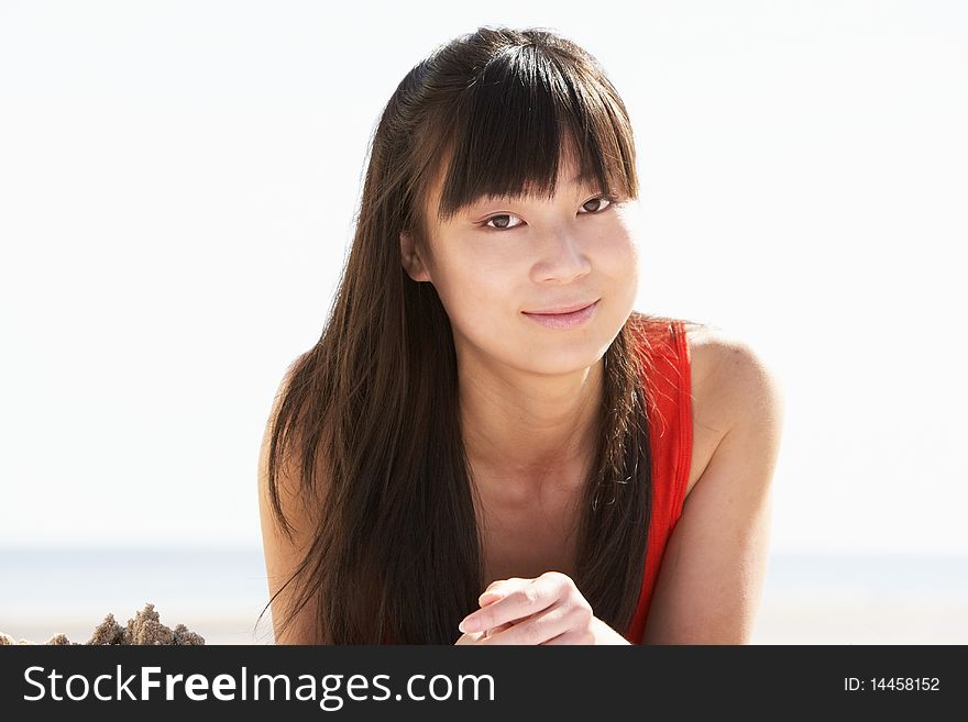 Young Woman Relaxing On Beach