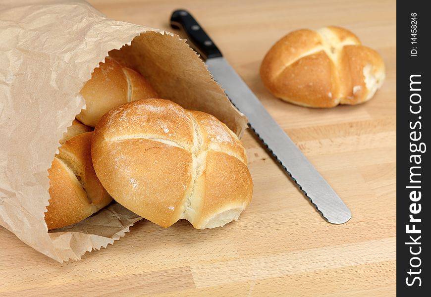Fresh bread rolls isolated on a kitchen bench