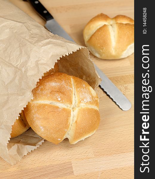 Fresh bread rolls isolated on a kitchen bench