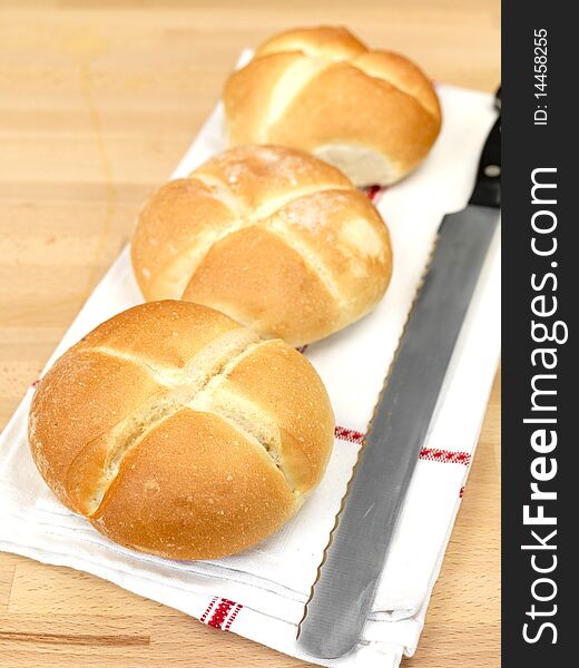 Fresh bread rolls isolated on a kitchen bench