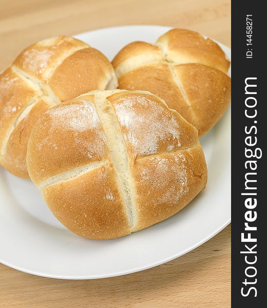 Fresh bread rolls isolated on a kitchen bench