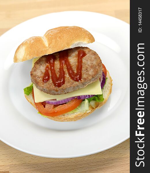 A freshly made American style hamburger with sauce