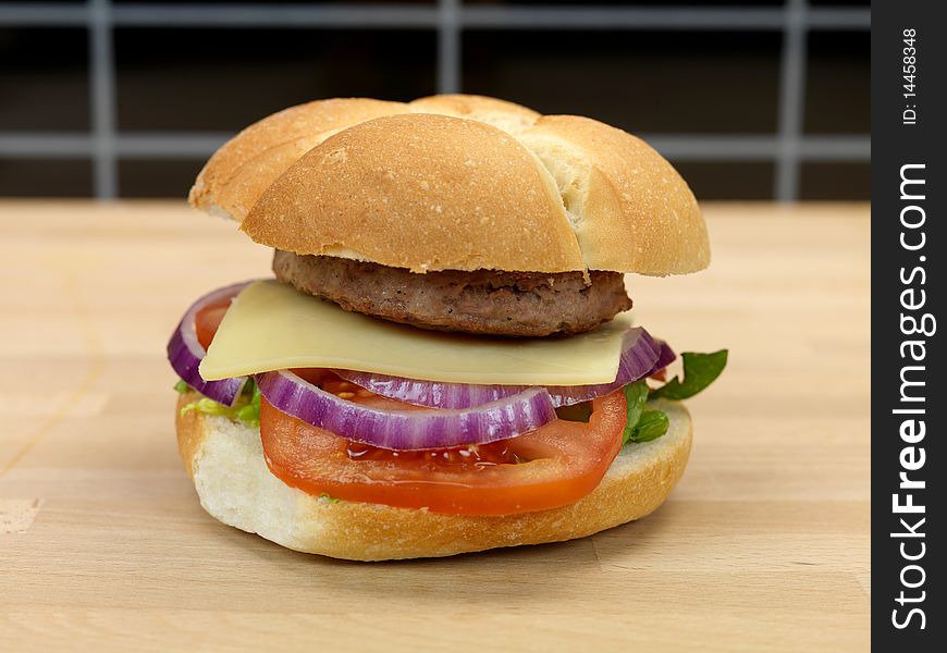 A freshly made American style hamburger with sauce