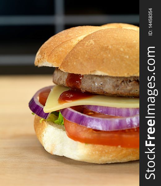 A freshly made American style hamburger with sauce