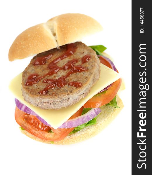 A freshly made American style hamburger with sauce