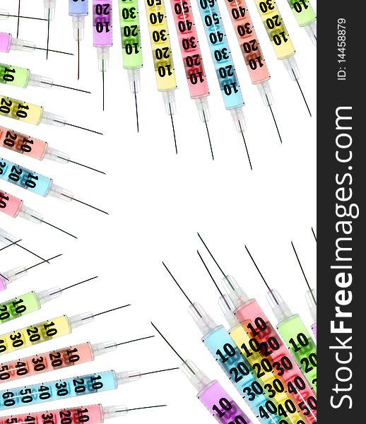 A set of multicolored syringes on a white background with copy space. A set of multicolored syringes on a white background with copy space