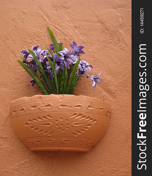 A beautiful piece of southwestern pottery with
a purple flower arrangement. A beautiful piece of southwestern pottery with
a purple flower arrangement.