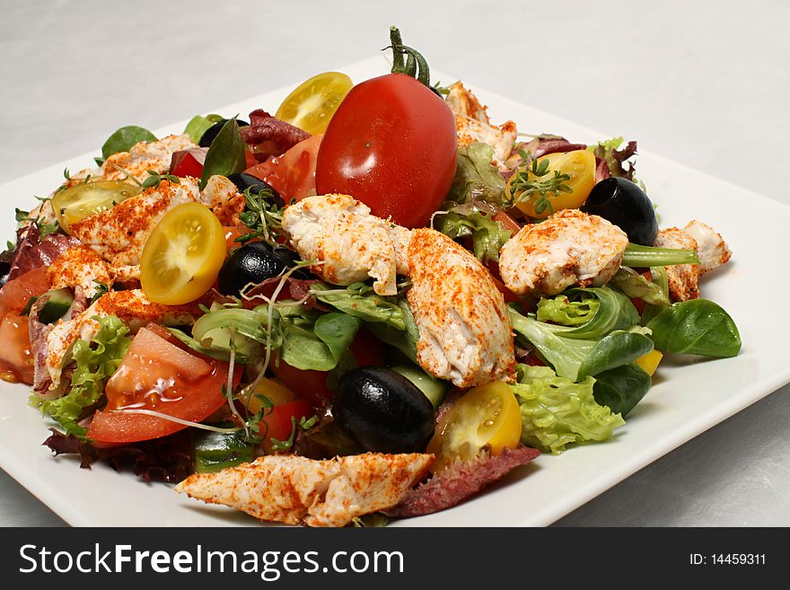 Closeup of the chicken salad with red cherry tomato. Closeup of the chicken salad with red cherry tomato