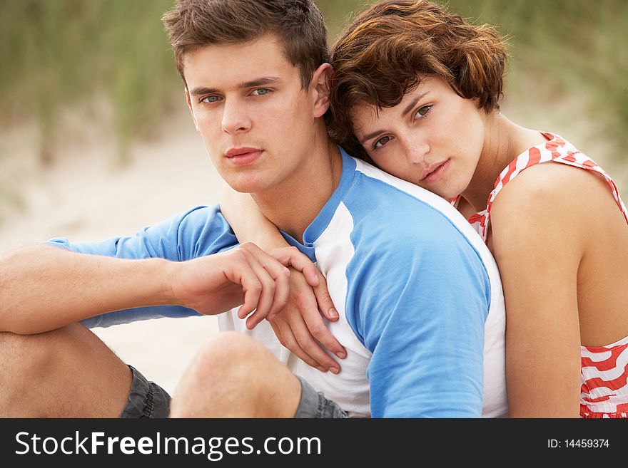 Romantic Young Couple Embracing On Beach