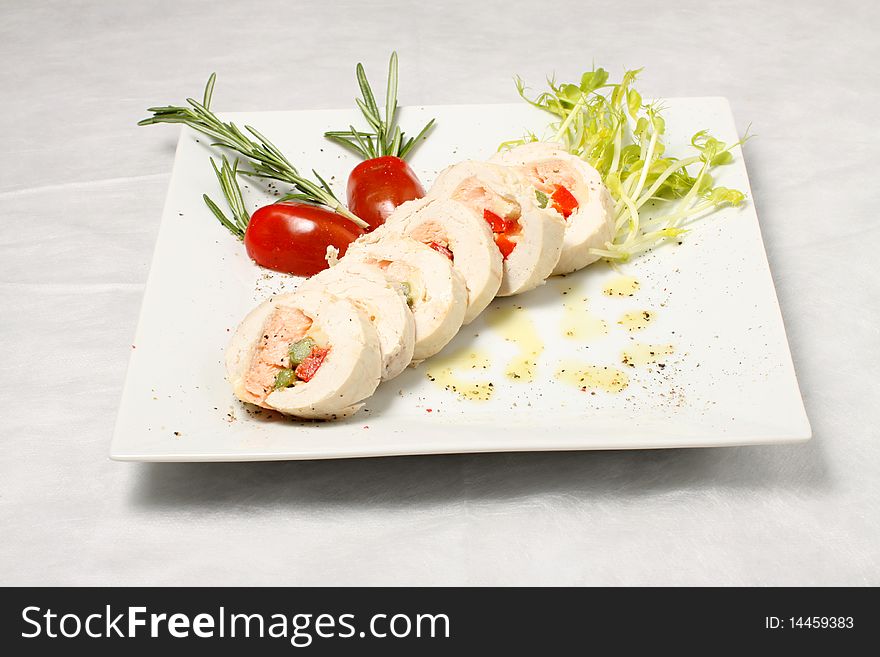Sliced chicken fillet with salmon meat. Sliced chicken fillet with salmon meat