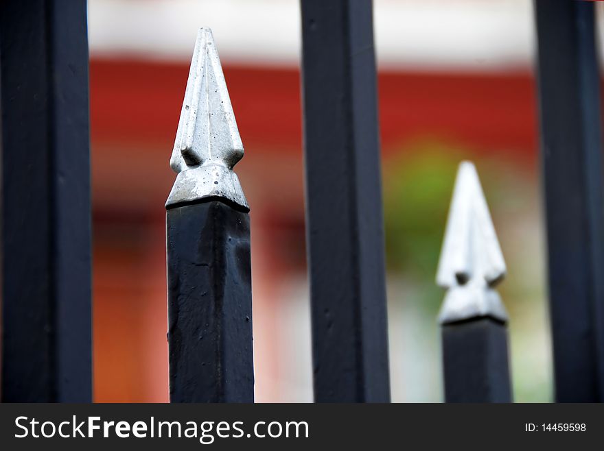 Architectural details, spires on metallic fence closeup. Architectural details, spires on metallic fence closeup