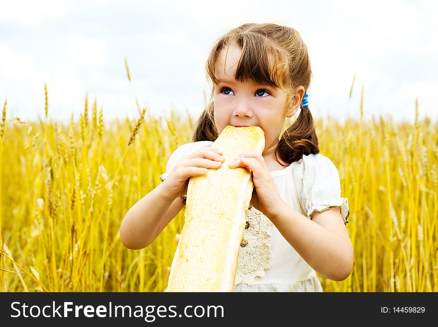 Girl Eating A Long Loaf