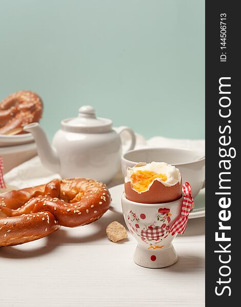 Rustic Breakfast. Boiled Eggs And Pastries On White Wooden Background