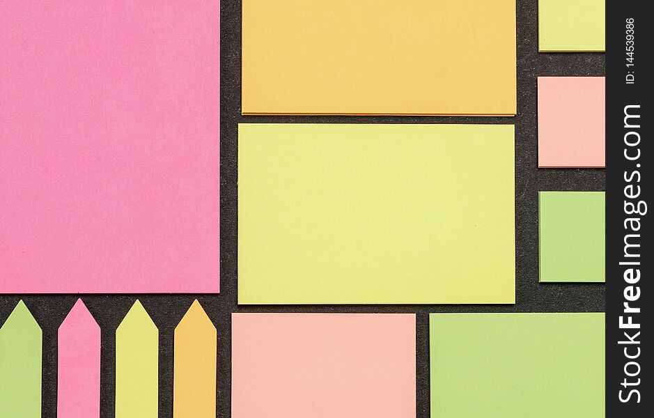 Blank note paper set of different colours forms and sizes. Sticky notes collection on black background