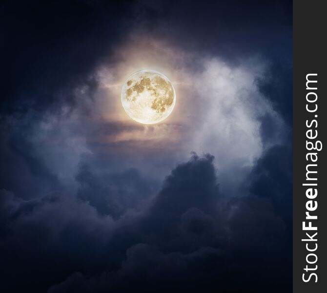 Full moon in dramatic clouds at night. Full moon in dramatic clouds at night