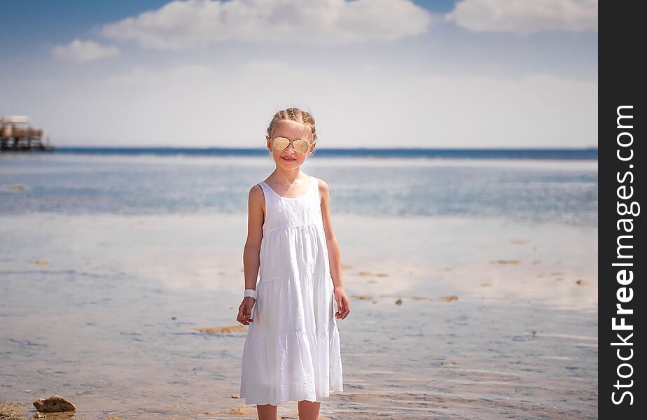 Girl Standing At Seashore