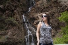 Woman With Sunglasses By Waterfall Royalty Free Stock Images