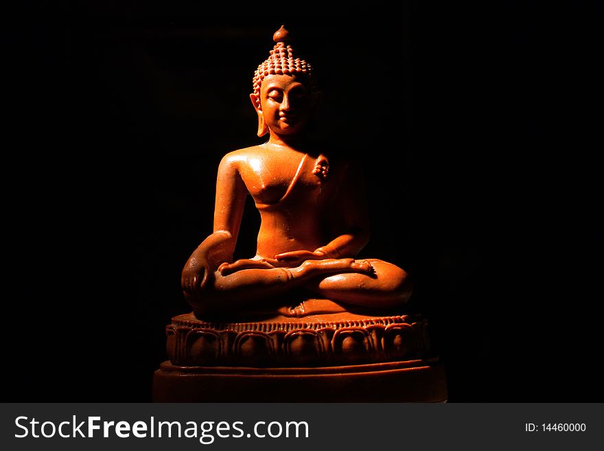 Light of Buddha image in the dark background.