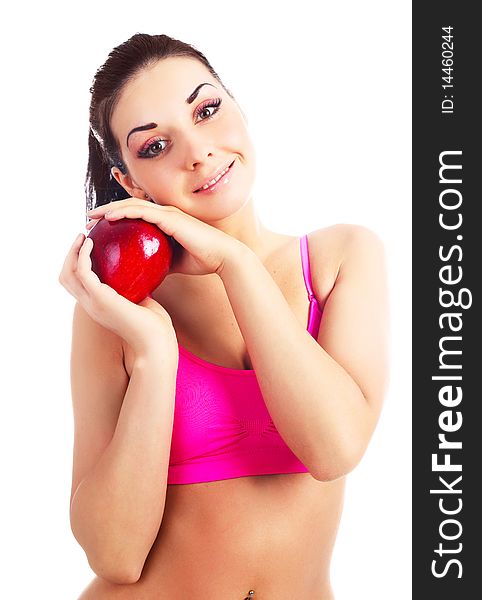 Beautiful young brunette girl eating a big red apple. Beautiful young brunette girl eating a big red apple