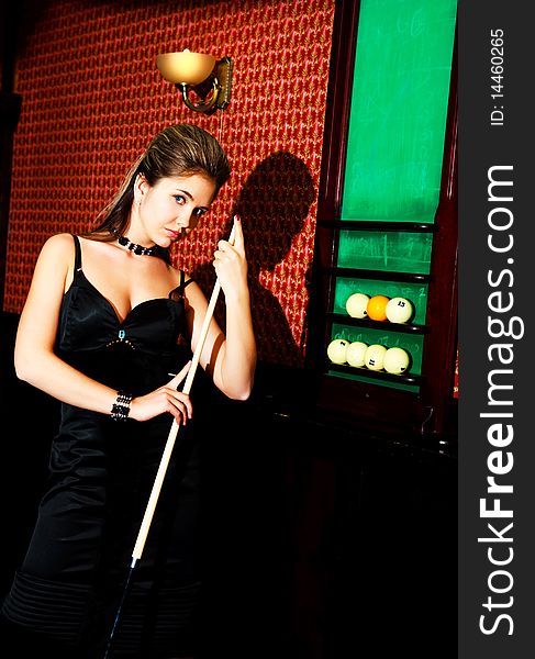 Woman playing billiard