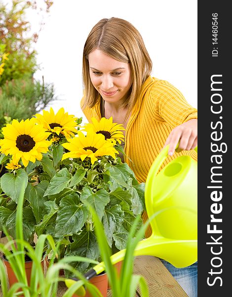 Gardening - woman pouring flowers with watering can