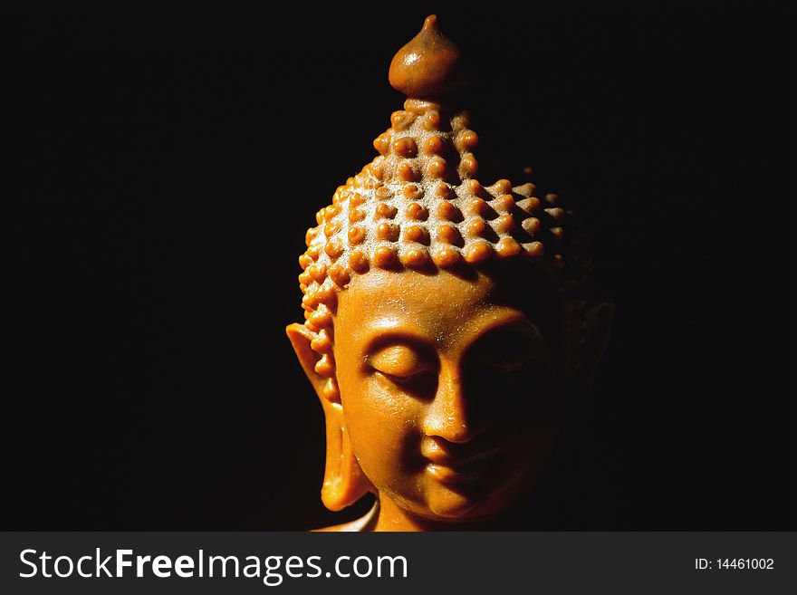 Light of Buddha image in the dark background.