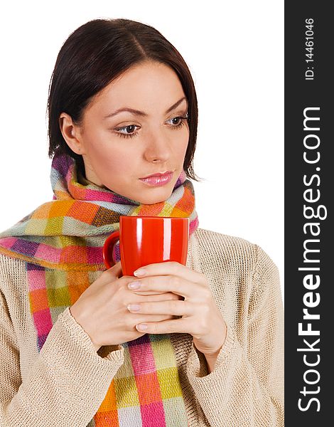 Yougn beautiful woman in warm scarf with a cup of tea. Yougn beautiful woman in warm scarf with a cup of tea