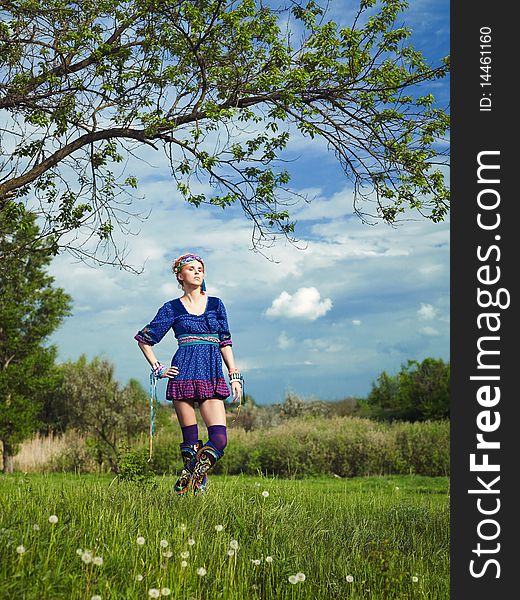 Beautiful young woman standing on grass