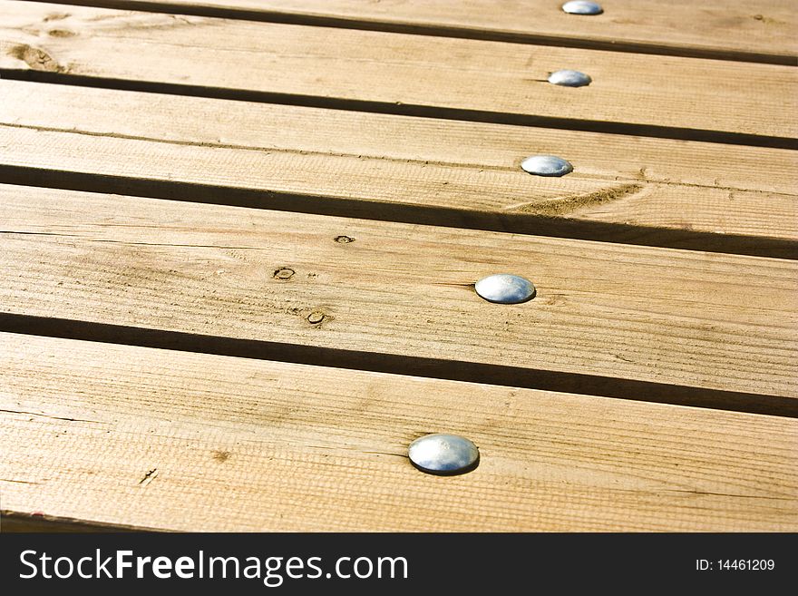 Wooden floor with grey nails as background